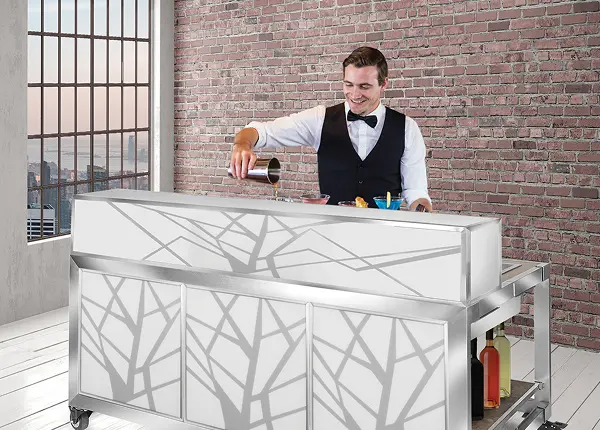 Bartender serving drinks behind The Hub product from Eastern Tabletop